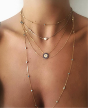 A Layered Gold mati necklace combination