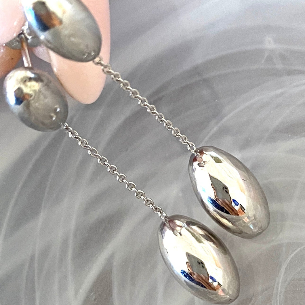 Earrings hanging solid silver elliptical spheres
