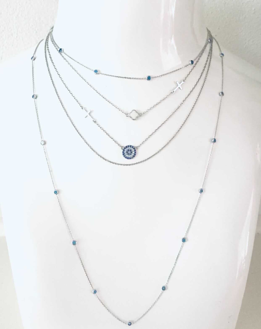 A Layered Gold mati necklace combination