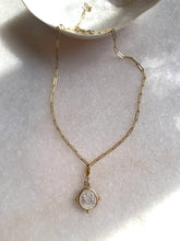 Byzantine coin pendant with open link chain.