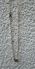 The 9k gold Apiro-infinity necklace