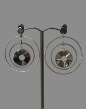 Three interlocking polished hoop earrings