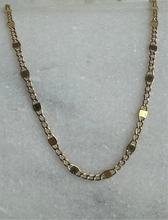 The 14k solid gold flat curb and  squares chain.