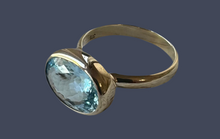 The Ophelia 9k gold blue topaz oval cushion ring.
