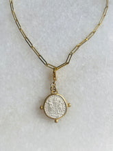 Byzantine coin pendant with open link chain.