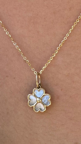 14k gold mother of pearl flower with sapphire