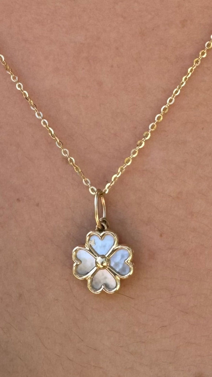 14k gold mother of pearl flower with sapphire