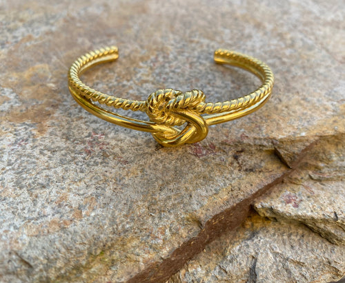 Gold double reef knot bangle