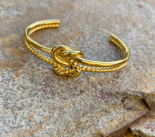 Gold double reef knot bangle