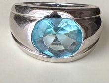 Dome shaped blue topaz ring