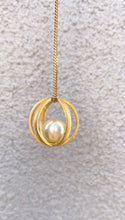 Brushed gold cage with pearl