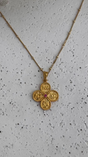 Reversible ICXC curved cross with red spinel.