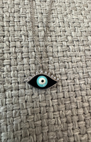The sparkly lashes with  blue enamel eye.