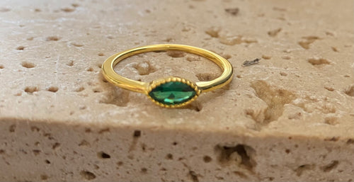 Gold and green eye ring