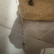 The fine ball necklace with hanging cross