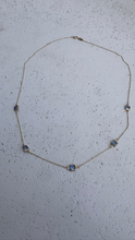 9k gold blue topaz emerald cut necklace