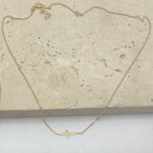 9k Gold resting Cross necklace