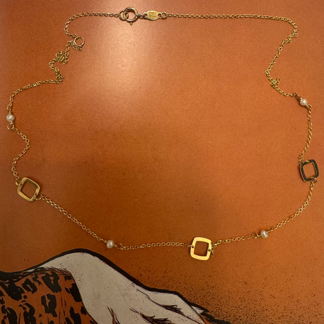 Golden open squares and Akoya pearl necklace