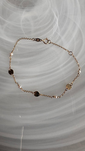 14k gold Akoya pearls and discs bracelet.