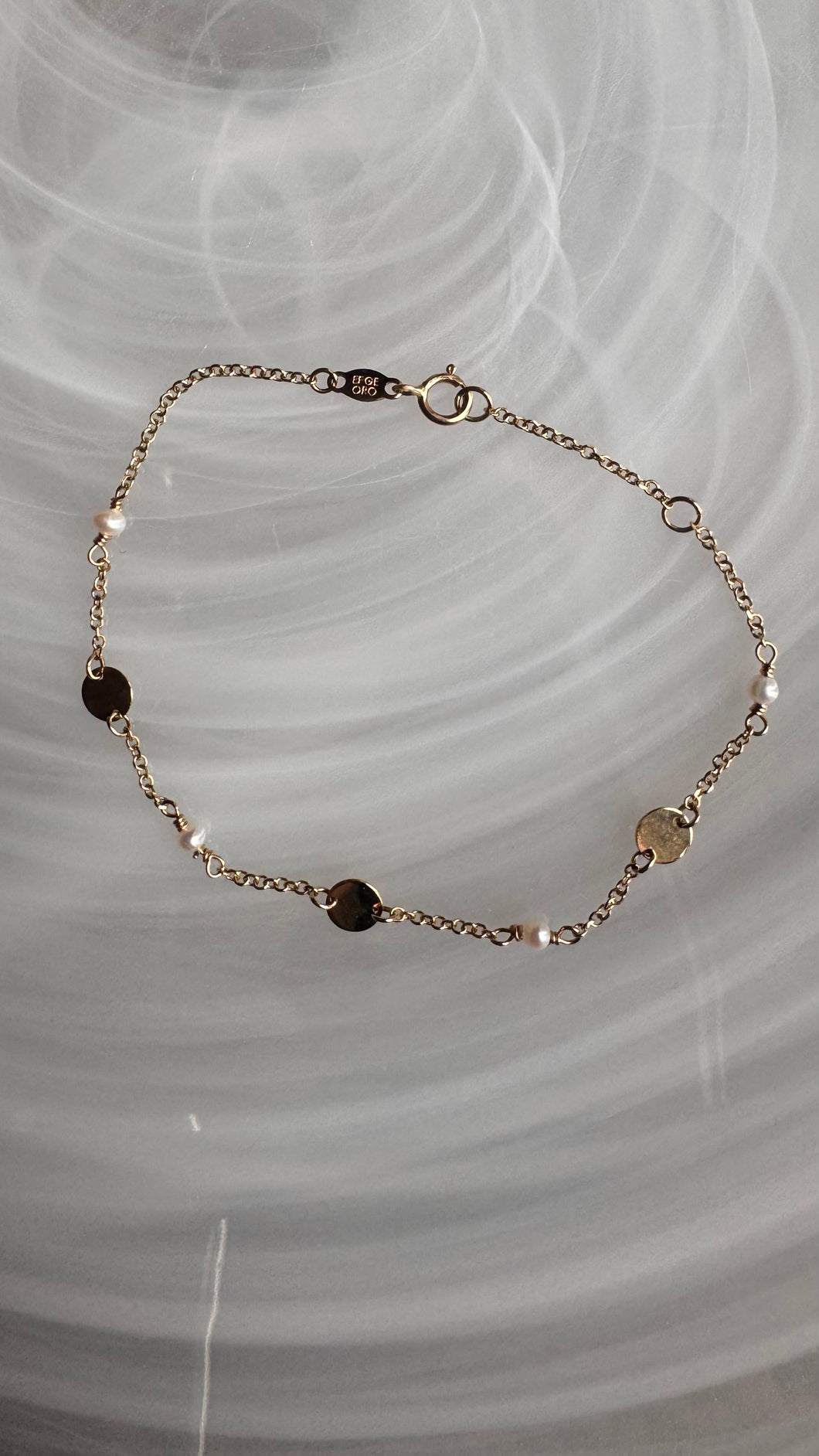 14k gold Akoya pearls and discs bracelet.