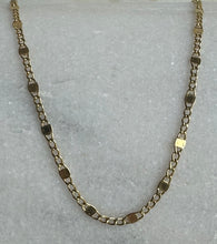 The 14k solid gold flat curb and  squares chain.