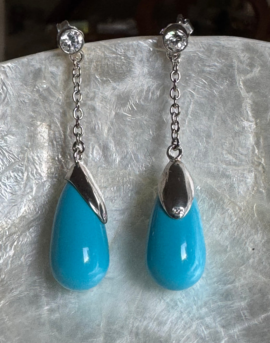 Christina rhodium turquoise C.Z. Stud chain drop earrings.