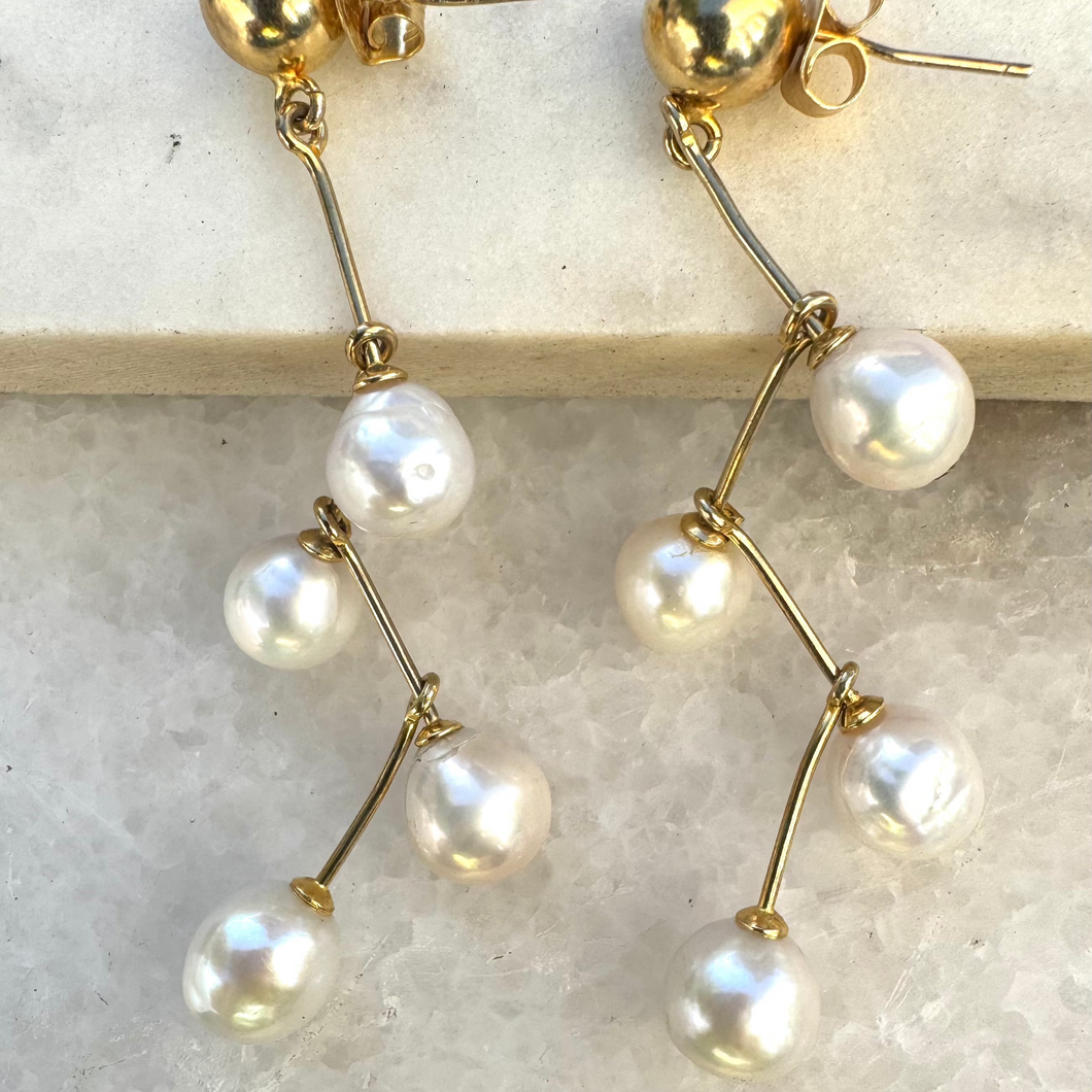 Gold ball studs with 4 fresh water pearls.