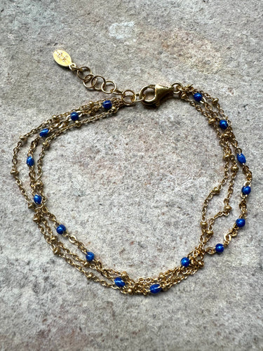 The triple row lapis and gold bracelet.