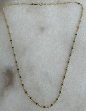 The 14k solid gold flat curb and  squares chain.