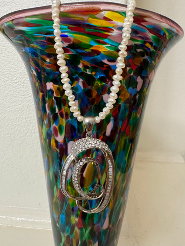 Large vintage swirl pendant on  fresh water pearl strand
