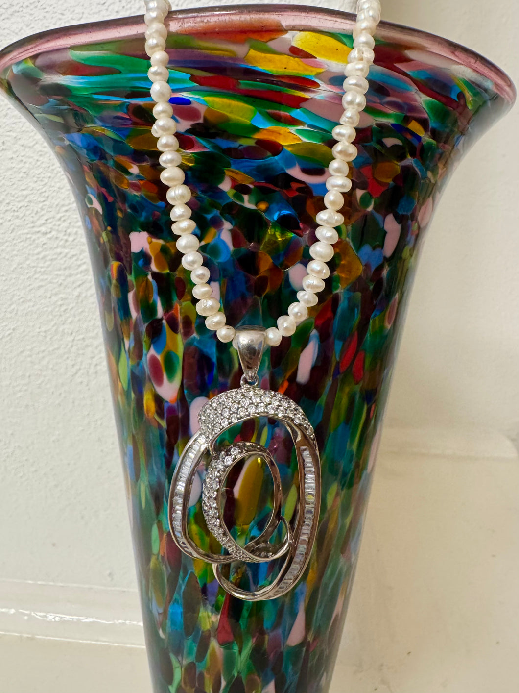 Large vintage swirl pendant on  fresh water pearl strand
