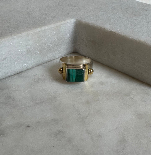 The malachite ring with gold details