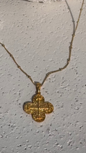 Reversible ICXC curved cross with red spinel.