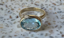 The Ophelia 9k gold blue topaz oval cushion ring.