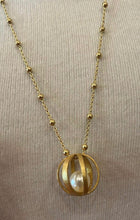 Brushed gold cage with pearl