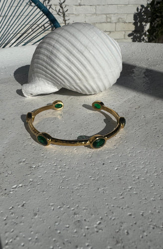 Hammered open bangle with green cubic zircons