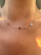 The 14k gold flowers and pearls necklace