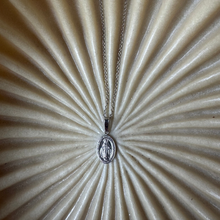 Miraculous coin necklace