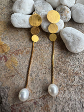 Monte Carlo pearl earrings.