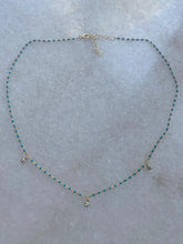 Tiny green and gold beads with 3 cubic zirconia drops