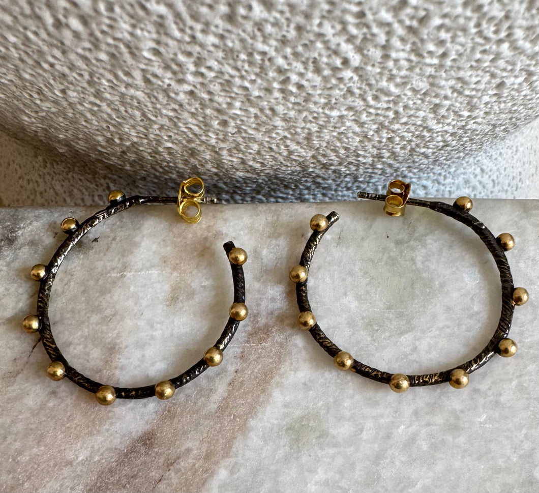 ‘Anna’ black oxidised hoop studs with yellow gold beads.