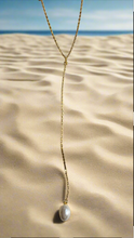 Single pearl lariat necklace