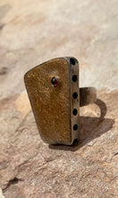 The handmade sandblast ring with garnet.