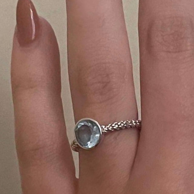 Round blue topaz ring