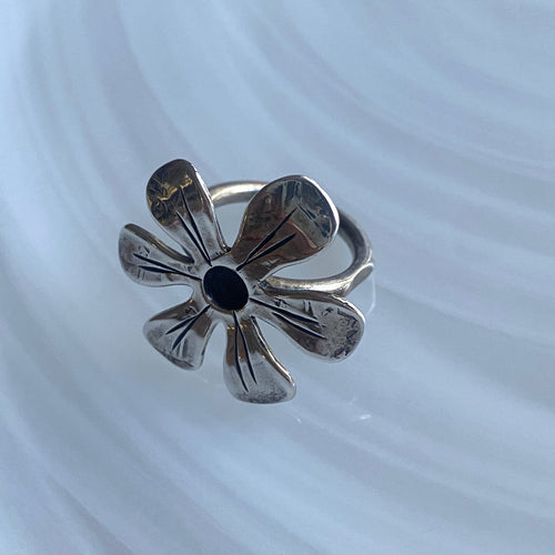 The oxidised flower ring
