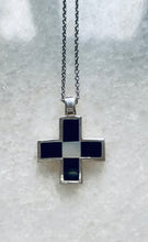 The black onyx and mother of pearl unisex cross.