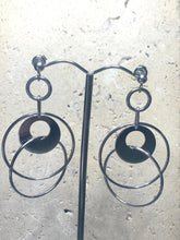Three interlocking polished hoop earrings