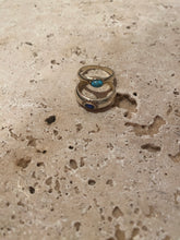 The curved turquoise ring
