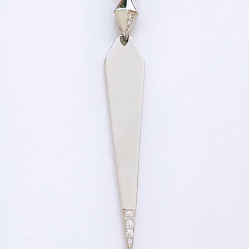 A shiny spike necklace with cubic zirconia, displayed on a plain background.