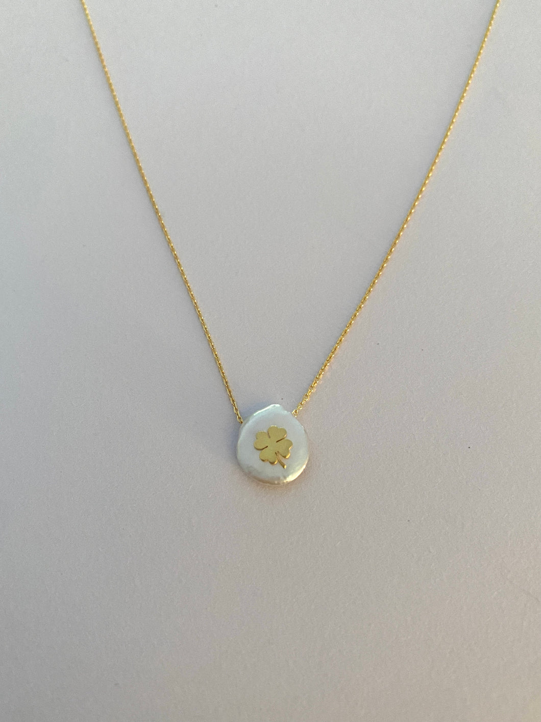 Lucky 4 leaf clover in gold on mother of pearl necklace and 18k yellow gold plated chain